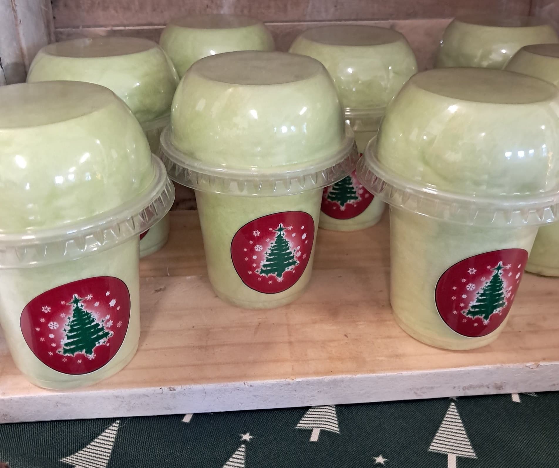 Christmas themed milkshake cups with festive tree stickers