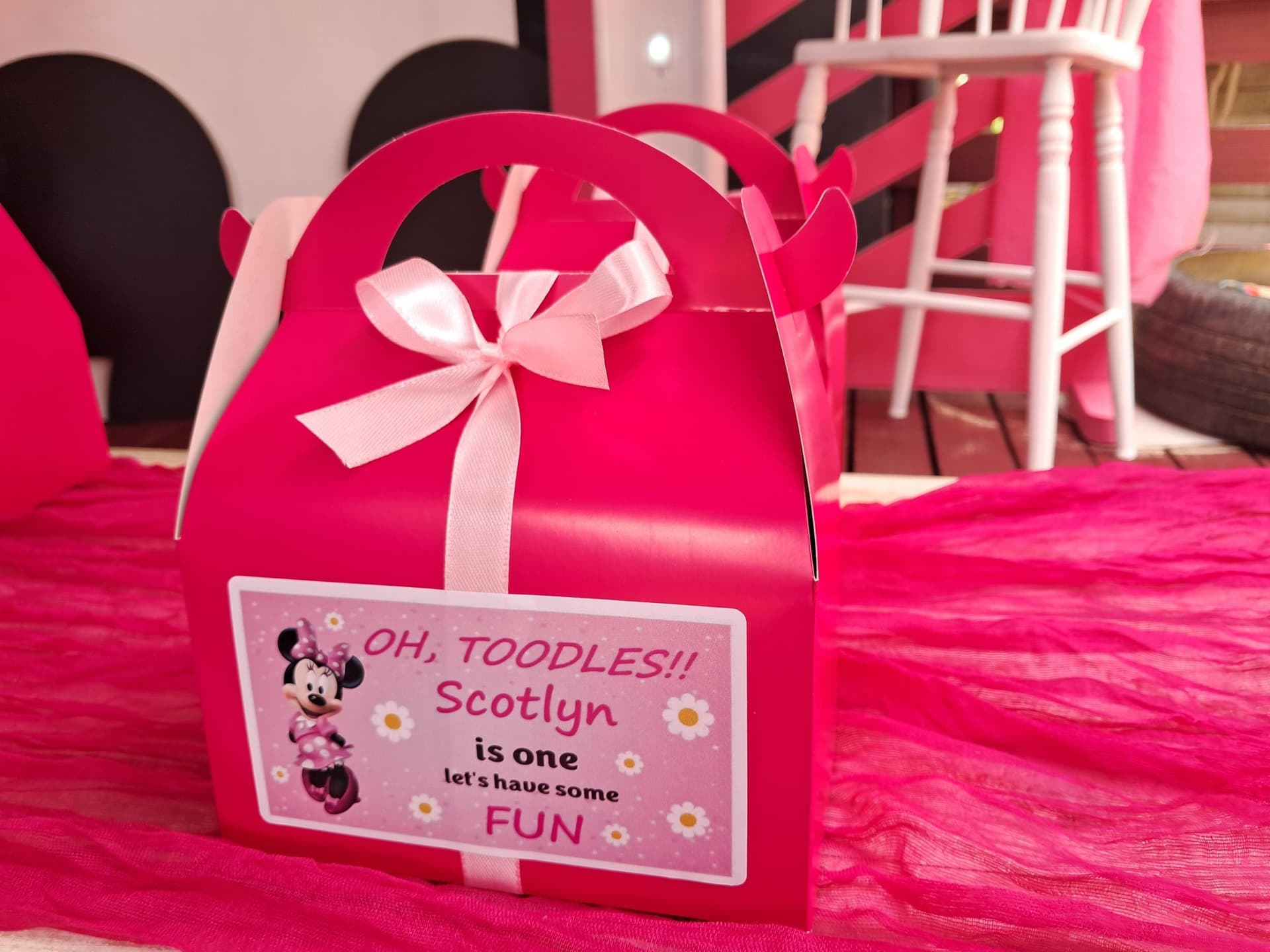 Pink Minnie Mouse themed party pack box with ribbon bow